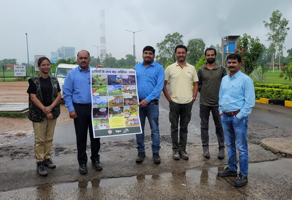 Team WTI hands over poster of human-elephant conflict mitigation
